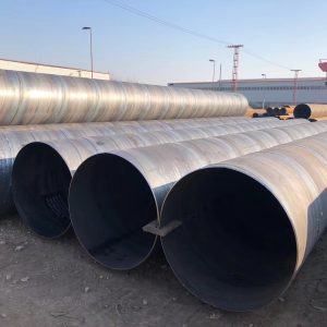 Large diameter welded steel pipes stored in a yard