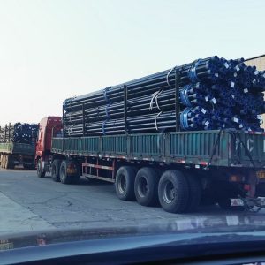 Steel pipe bundles loaded on truck for delivery